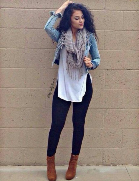 short denim jacket with a long white blouse and black leggings