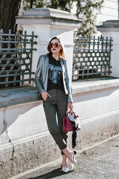 silver blazer with black printed t-shirt and checked, cropped trousers
