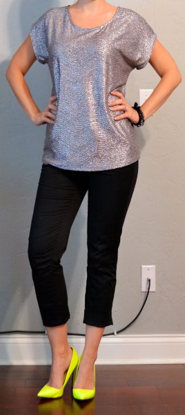 silver t-shirt with scoop neckline, black, cropped jeans and yellow heels