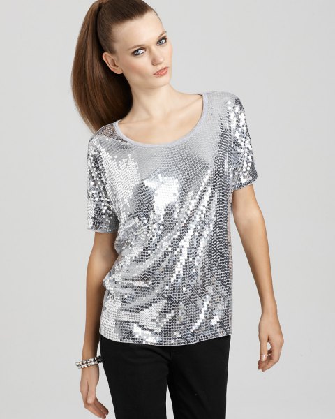 silver top with scoop neckline and black slim fit trousers