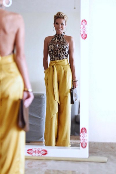 silver sequin halter top with yellow wide-leg pants