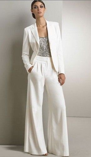 silver top with white blazer and matching flared trousers