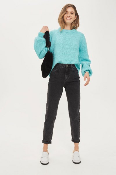 sky blue knitted sweater with mock-neck knit and black mom jeans