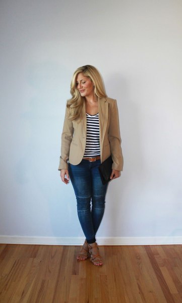 light brown, slightly oversized blazer with a black and white striped tank top with a scoop neckline