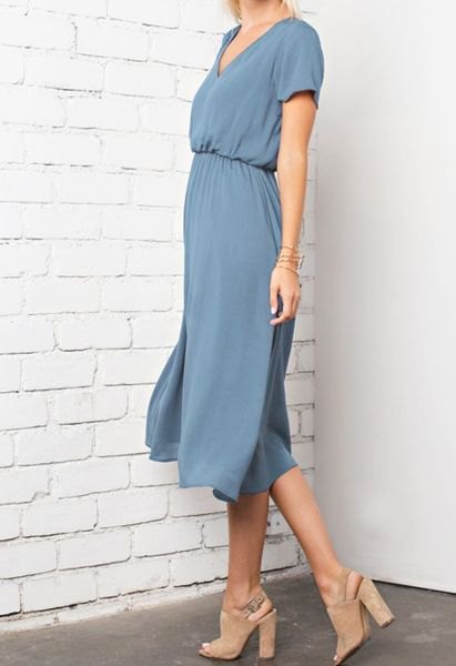 blue-green midi dress with a gathered waist and open toe heels made of pink suede