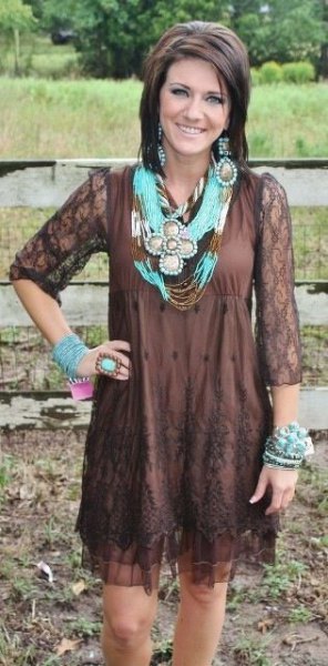 Chocolate brown mini sheath dress made of lace with three-quarter sleeves