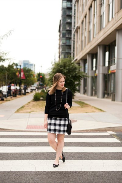 Three-quarter sleeved sweater, black and white checked mini skirt