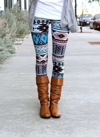 Tribal patterned leggings with brown knee-high boots and a gray cardigan