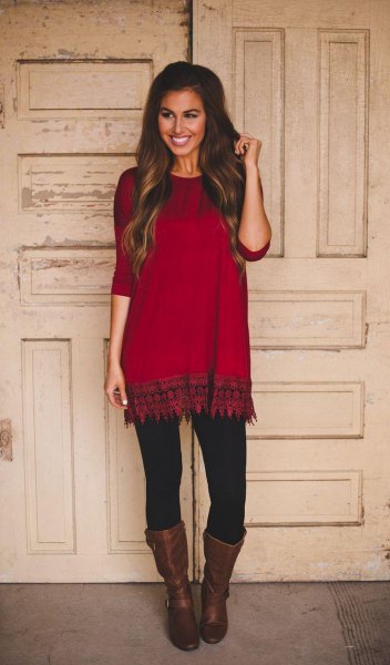 red and black tunic with tribal print and leather boots with a medium calf