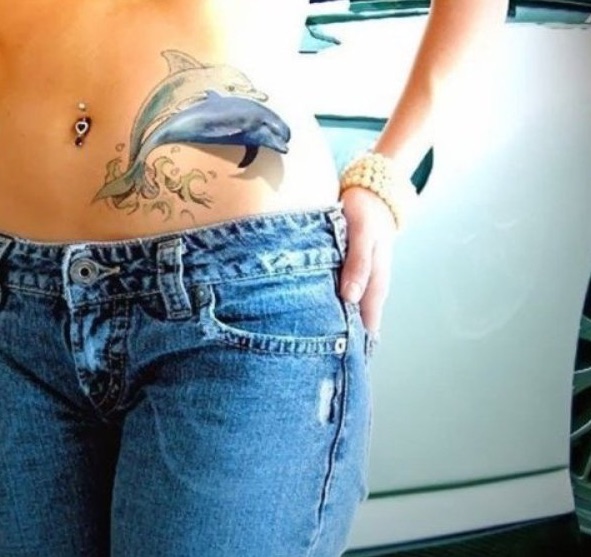 Two dolphin tattoo on the waist