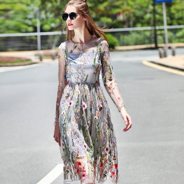 Two-layer midi dress with a chiffon floral pattern and a gathered waist and long sleeves