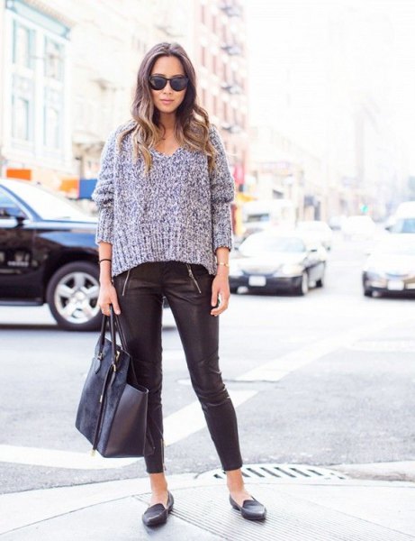 gray, chunky V-neck sweater with leather leggings and slippers