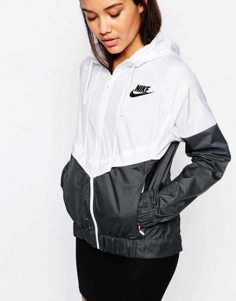 white and black color-block windbreaker with skinny jeans