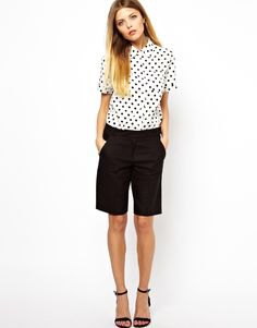 white and black polka dot shirt and long shorts
