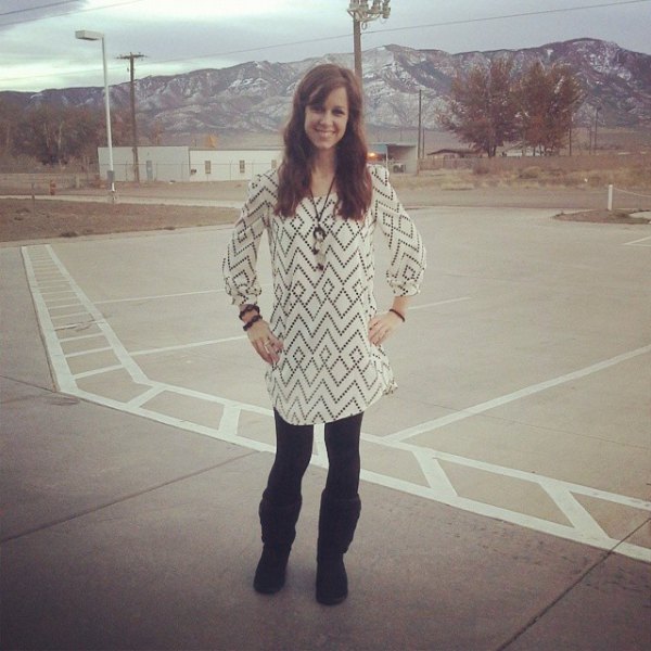 white and black printed tunic blouse with black, fleece-lined leggings and boots