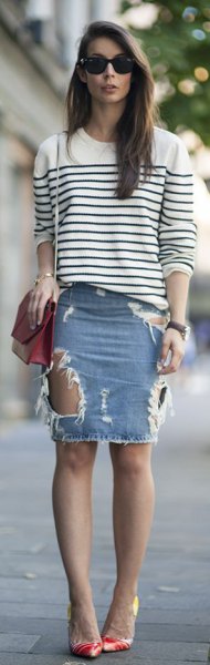 white and black striped knitted sweater with a round neckline and light blue denim mini skirt