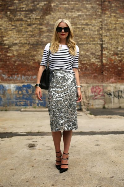 white and black striped knitted sweater with gold midi sequin skirt