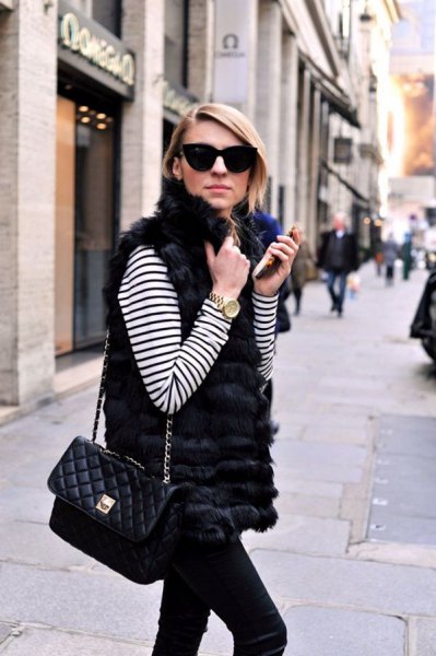 white and black striped long-sleeved T-shirt with fur vest and slim-fitting jeans