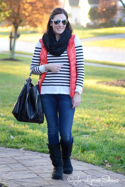 white and black striped sweater with knee-high boots made of suede