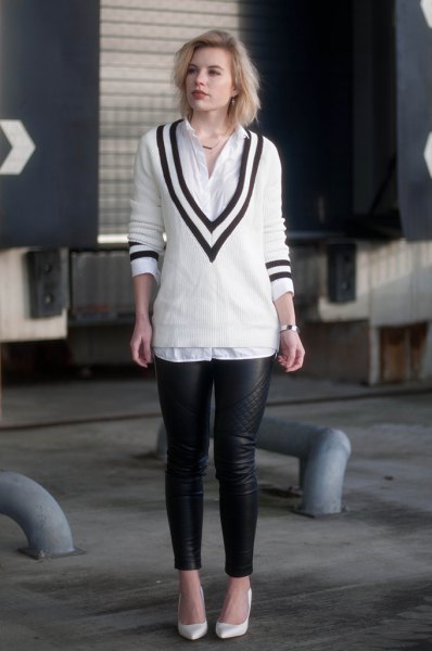 white and black V-neck sweater, shirt with buttons and leather gaiters