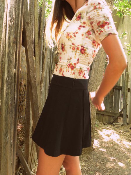 white and blushing floral t-shirt and black mini skirt