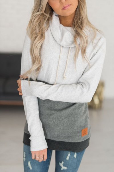 white and gray color block hoodie with ripped skinny jeans