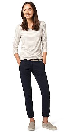 white and light gray striped long-sleeved top with slim fit jeans with black cuffs