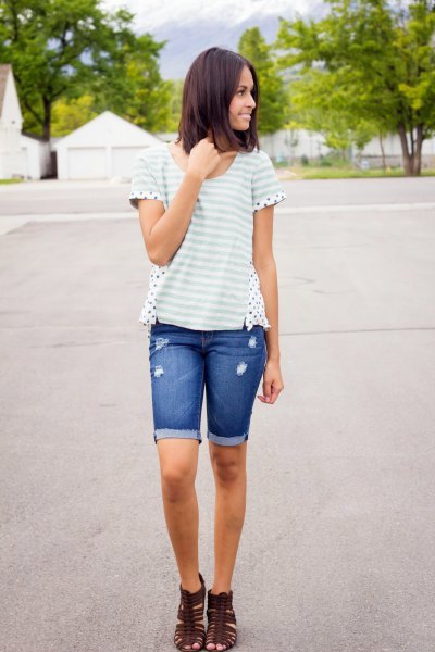 white and light gray striped t-shirt with long denim shorts with blue cuffs