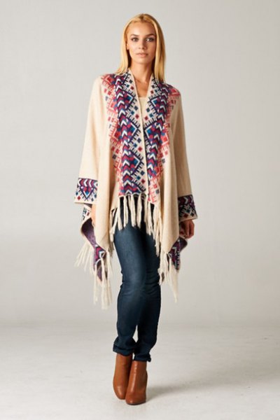 white and dark blue cardigan with fringes and brown leather ankle boots