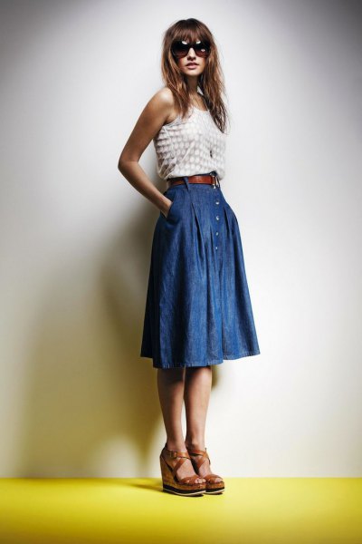 white and pink dotted vest top with blue pleated knee-length denim skirt