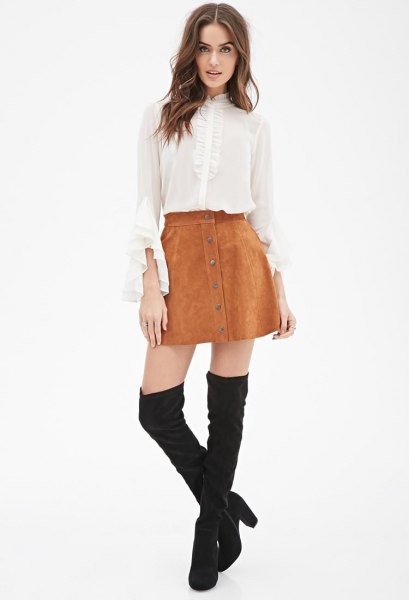 white chiffon blouse with bell sleeves, mini suede skirt and overknee boots