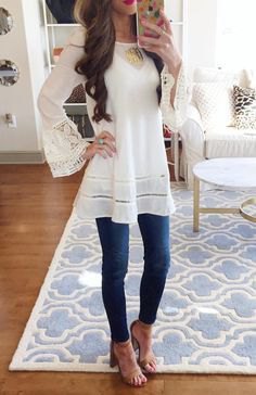 white long tunic blouse with bell sleeves and sandals
