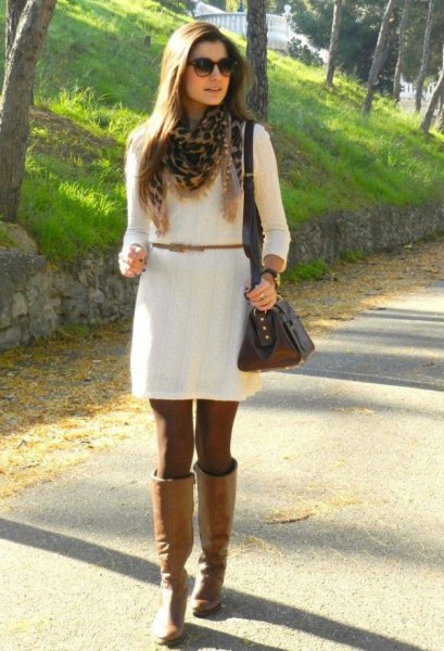 white dress with belt and knee-high camel leather boots
