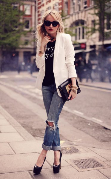 white blazer with black printed t-shirt and ripped jeans