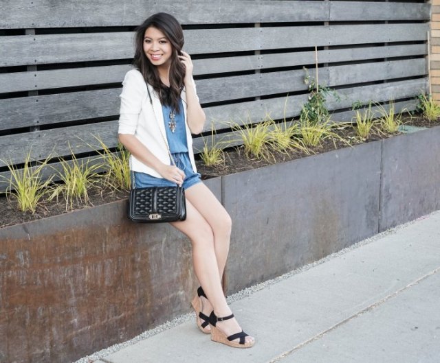 white blazer with blue mini-shorts and black lace-up sandals