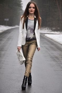 white blazer with gray t-shirt with scoop neckline and gold trousers