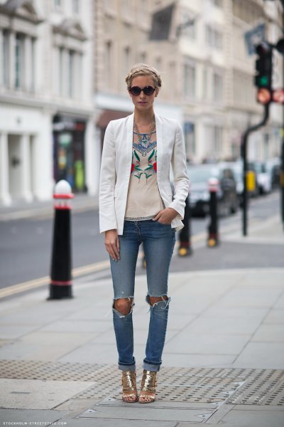 white blazer with pink graphic t-shirt and ripped jeans