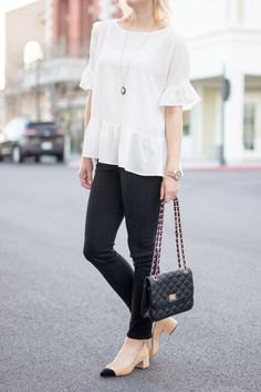 white blouse black skinny jeans pink heels