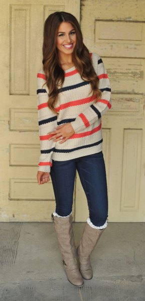 white blue and orange striped sweater with pink leather boots