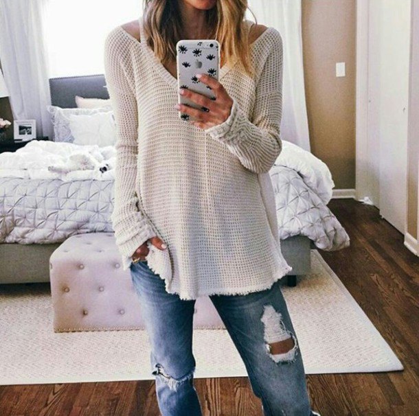 white V-neck sweater and boyfriend jeans