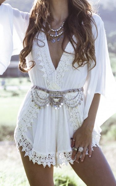 white lace wrap mini dress in boho style with silver statement belt