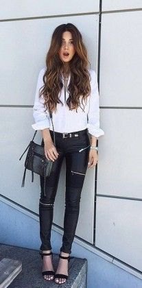 white blouse with button fastening, black biker pants and open toe heels with ankle straps
