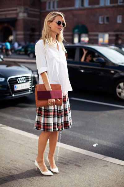 white blouse with button placket and checked skirt with a relaxed fit