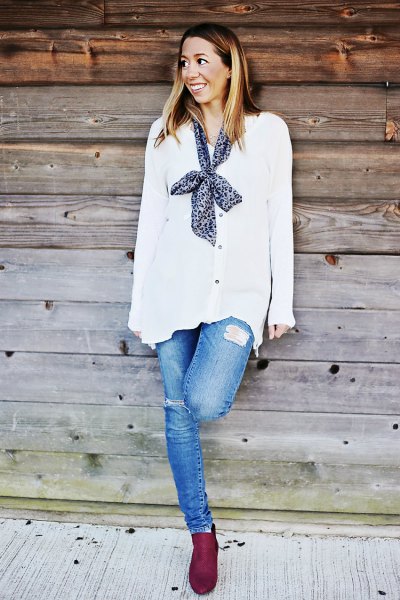 white chiffon cardigan with buttons and a narrow silk scarf on the back