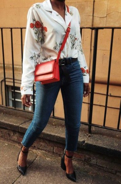 white blouse with floral pattern and blue jeans
