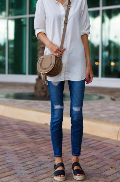 white long shirt with buttons, blue skinny jeans and sandals