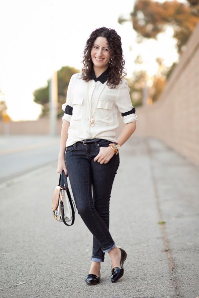 white shirt with buttons, black collar and skinny jeans with dark cuffs