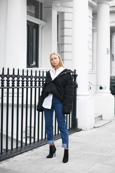 white shirt with buttons, black oversized winter jacket and jeans with cuffs