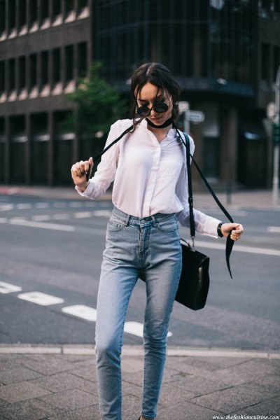 white shirt with buttons, black, narrow scarf and light blue jeans