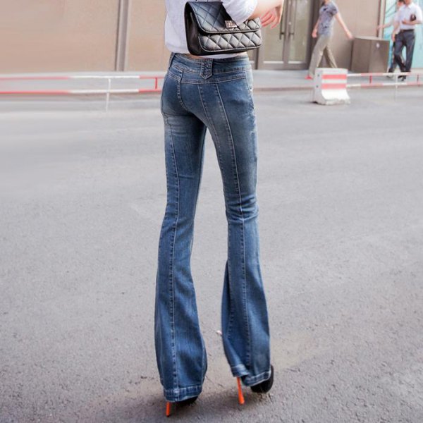 white shirt with buttons, jeans with blue flap and boots with heels